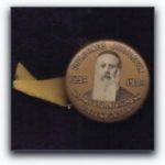 Image on century-old lapel button is priest, not rabbi