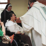 Woman celebrates birthday, coming into Catholic Church