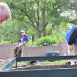 Retired priest, friends install new greenhouse