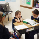 Catholic students help younger grades in myriad of ways