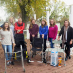 Occupational therapy students collect assistive devices