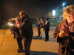 Praying for life by candlelight