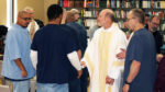 Bishop breaks bread with inmates