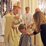 An invitation accepted: New Catholics celebrate the sacraments at Easter Vigil