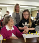 First Communion students build mini altars, learn alongside parents
