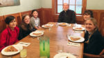 Video contest winners pray and eat with the bishop