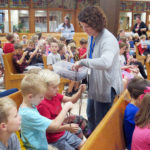 Students take home vocations prayer packets