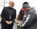Bishop Zinkula accompanies refugee on ICE check-in