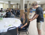 All Saints-Davenport eighth-graders receive a lesson in etiquette