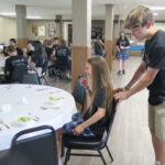 All Saints-Davenport eighth-graders receive a lesson in etiquette