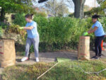 Bee the Difference Day: St. Ambrose students help neighbors with fall cleanup