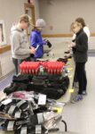Students stuff 'man' bags, purses for homeless