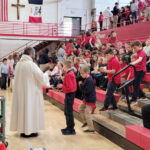 Gathering as one for Scott County Catholic schools Mass