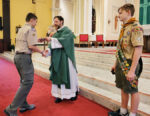 Religious medals presented at scouting Mass
