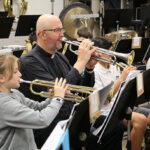 ‘You can always take music with you’: Parish priest joins Regina band for a day